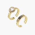 Gold-plated adjustable ring with twisted chain band, central cubic zirconia stone surrounded by crystal halo on cream background