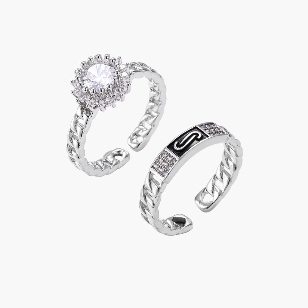 Two adjustable white gold plated rings with chain-link bands, featuring cubic zirconia halo and enamel details