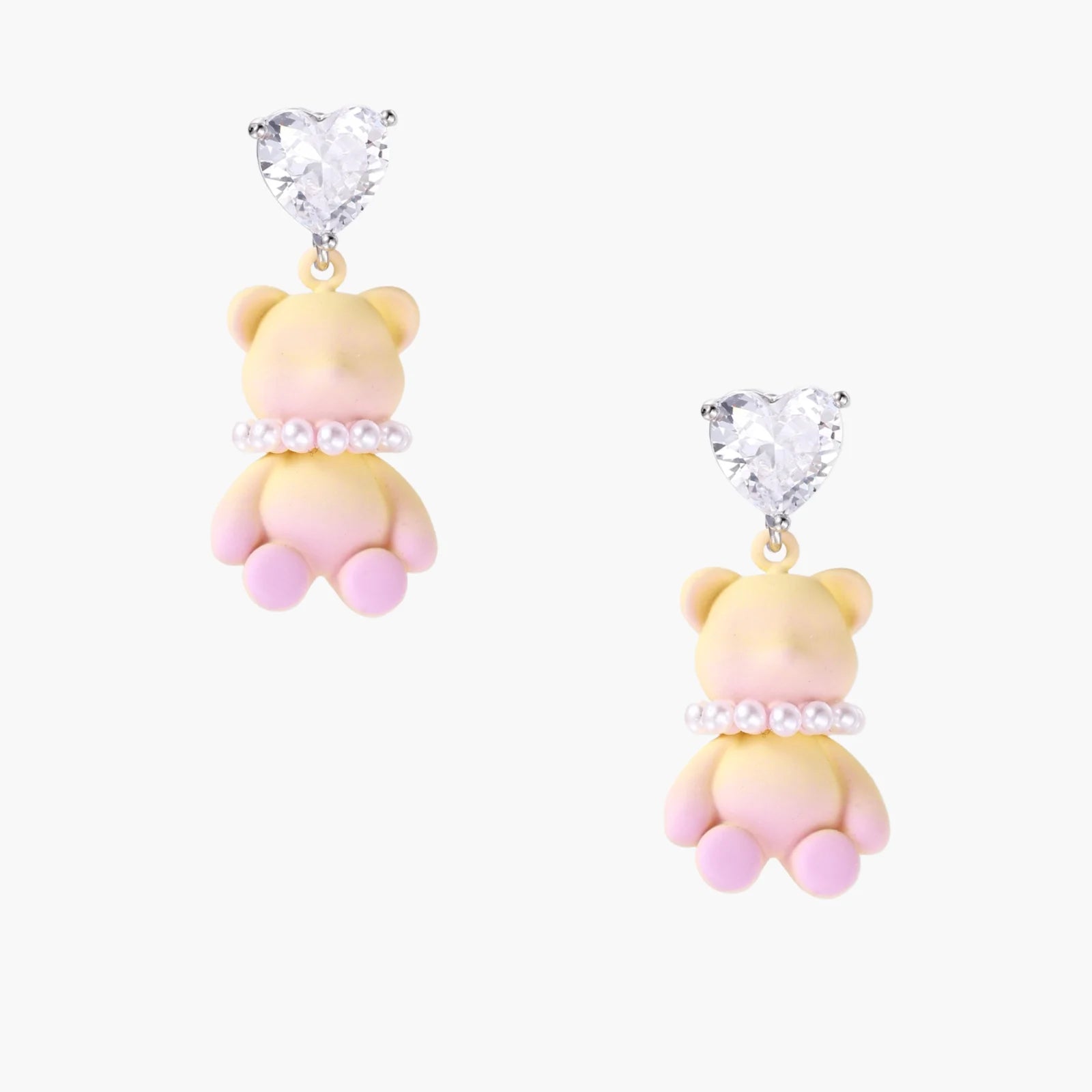 Dangle earrings with heart-cut zirconia studs and pastel teddy bear charms with pearl necklace details