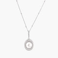 Oval sterling silver pendant with crystal halo surrounding a white freshwater pearl on delicate chain