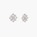 Ornate sterling silver stud earrings with mandala-inspired filigree pattern and four freshwater pearls on beige background