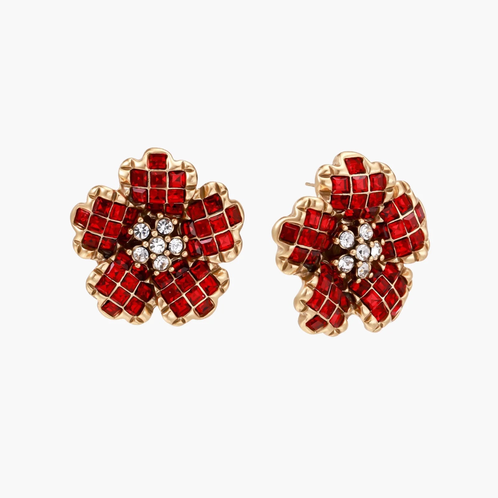 Gold-plated flower studs with burgundy square crystals in petal mosaic and clear center stones on beige background.
