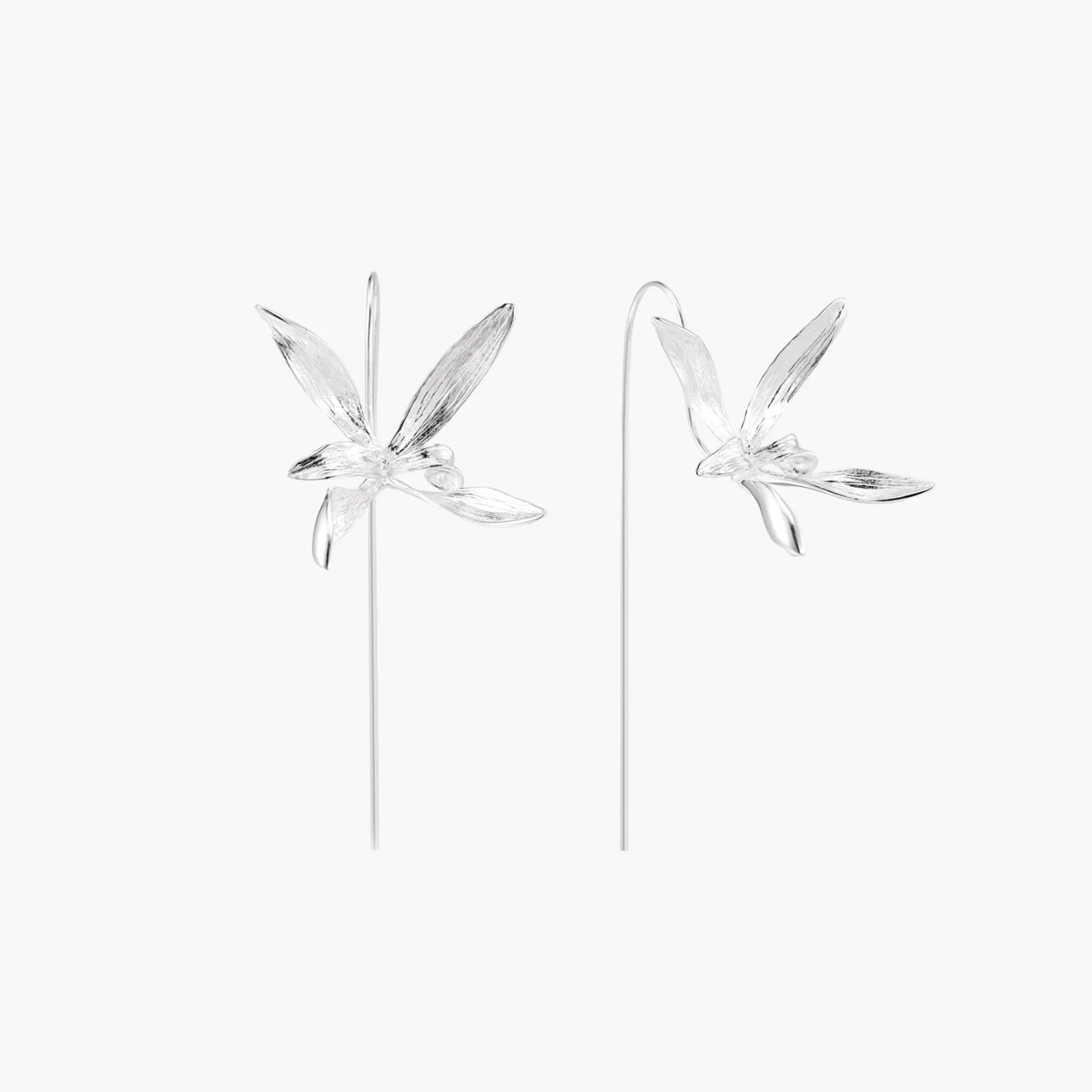 Delicate sterling silver dragonfly earrings with textured wings and curved threader hooks on white background