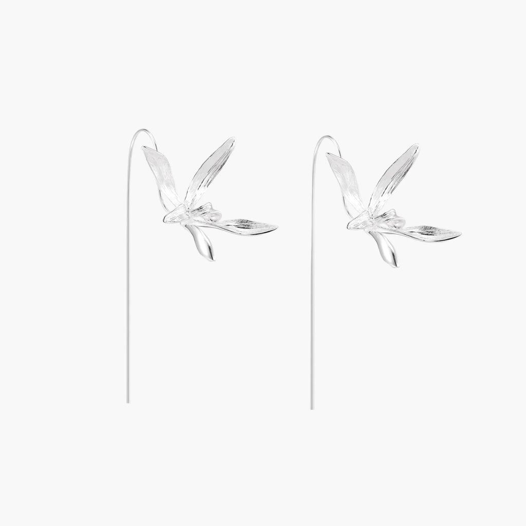 Delicate sterling silver dragonfly earrings with textured wings and curved threader hooks on white background