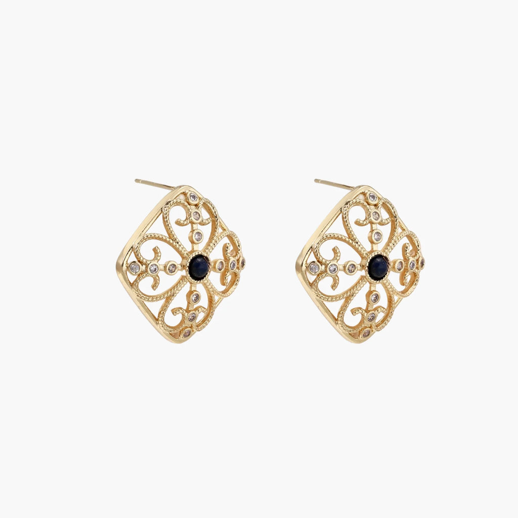Gold filigree stud earrings with navy lapis lazuli center stone and mother-of-pearl accents in ornate quatrefoil design