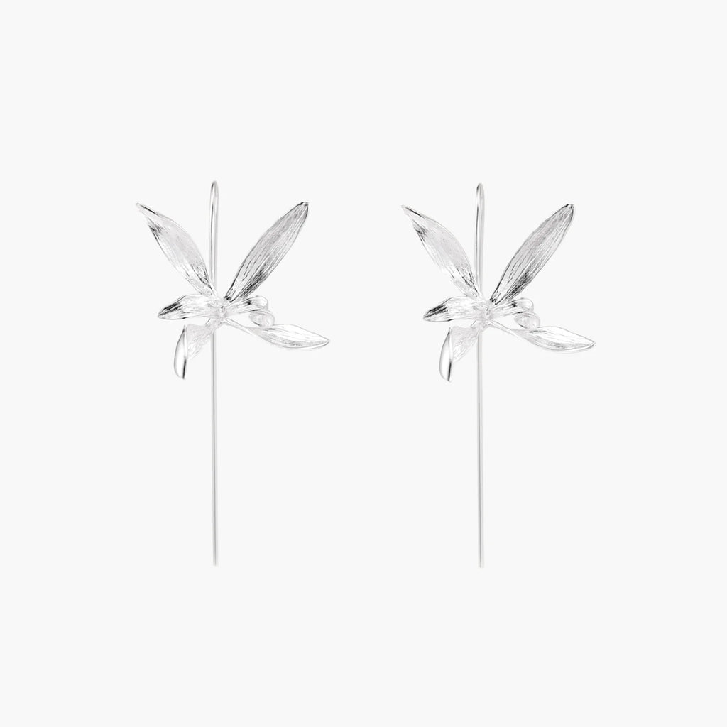 Delicate sterling silver dragonfly earrings with textured wings and curved threader hooks on white background