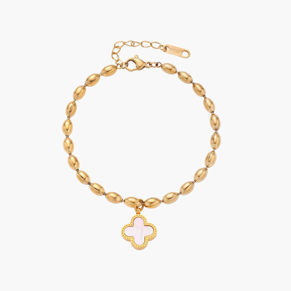 18K gold-plated oval bead chain bracelet with quatrefoil clover charm featuring mother of pearl inlay on cream background