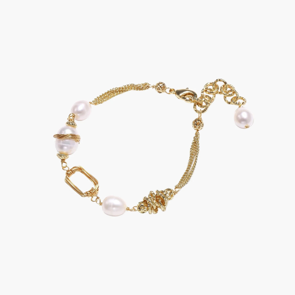 14K gold plated bracelet with freshwater pearls, filigree details, and mixed geometric elements on white background.