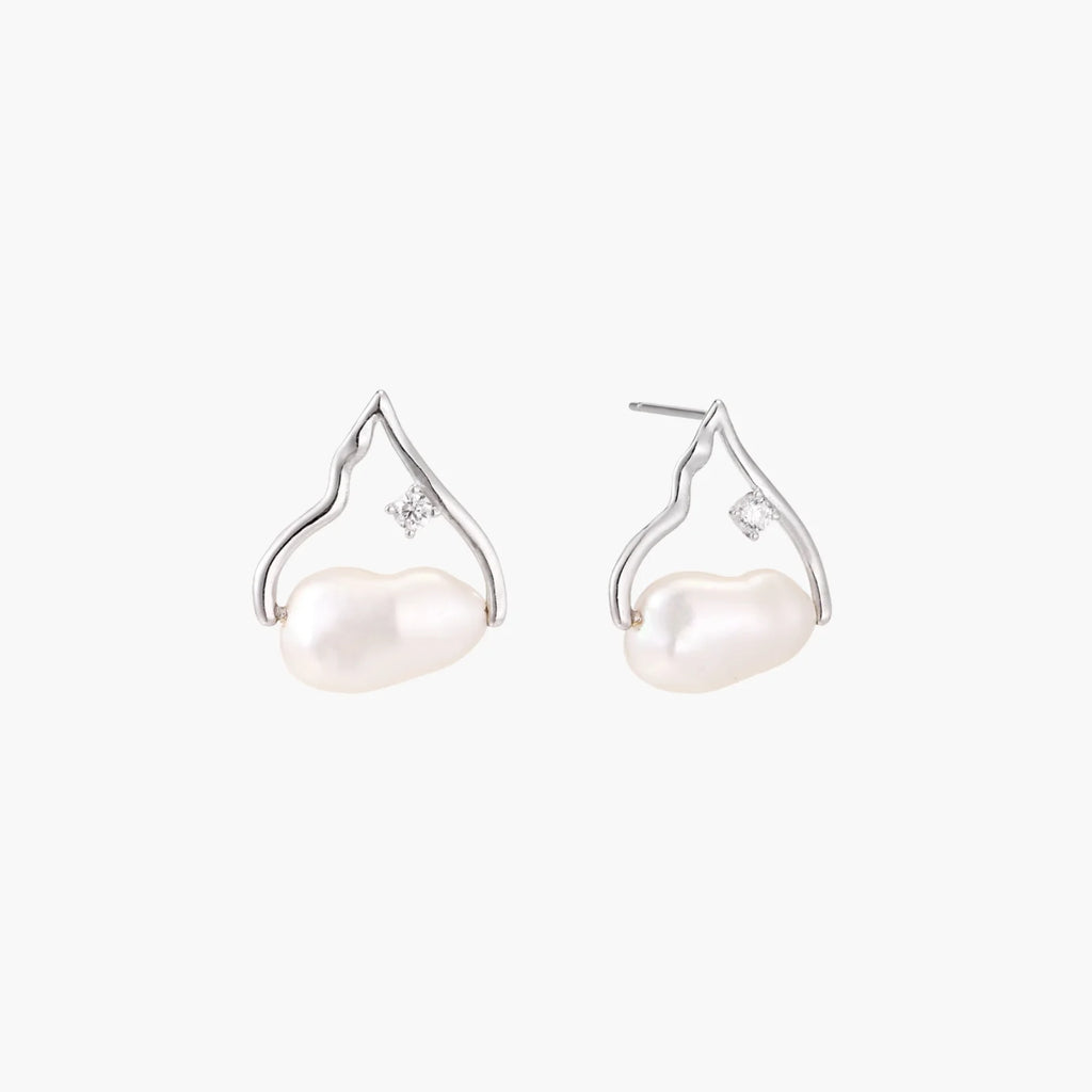 Silver mountain outline studs with baroque pearl and diamond accent on white background