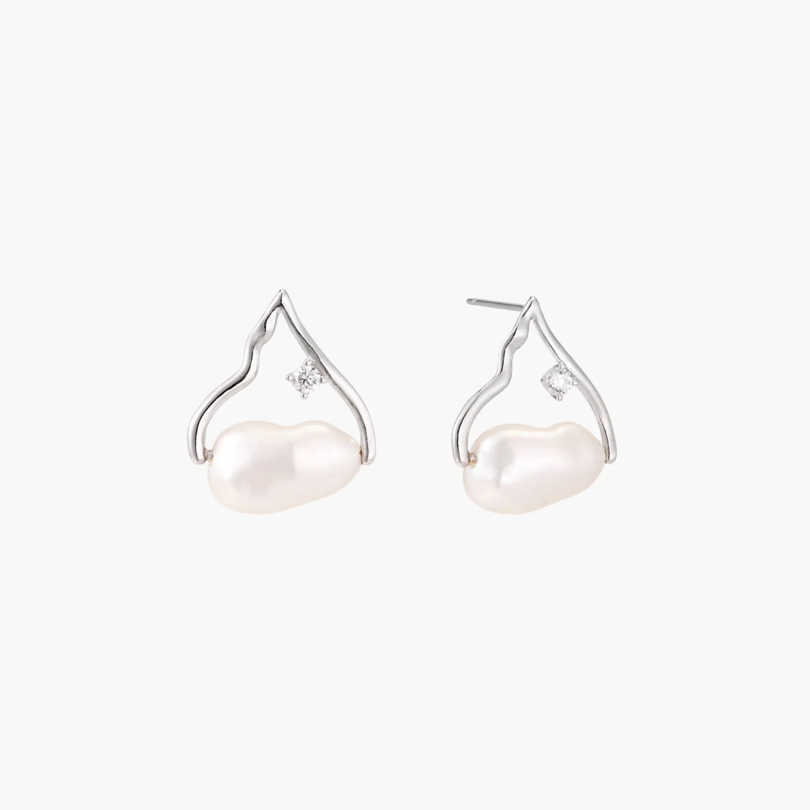 Silver mountain outline studs with baroque pearl and diamond accent on white background