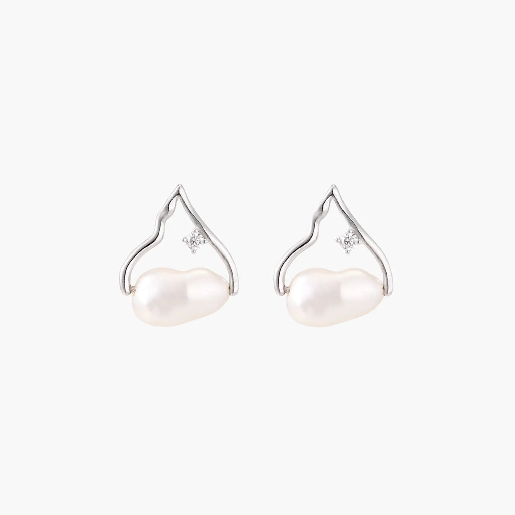 Silver mountain outline studs with baroque pearl and diamond accent on white background