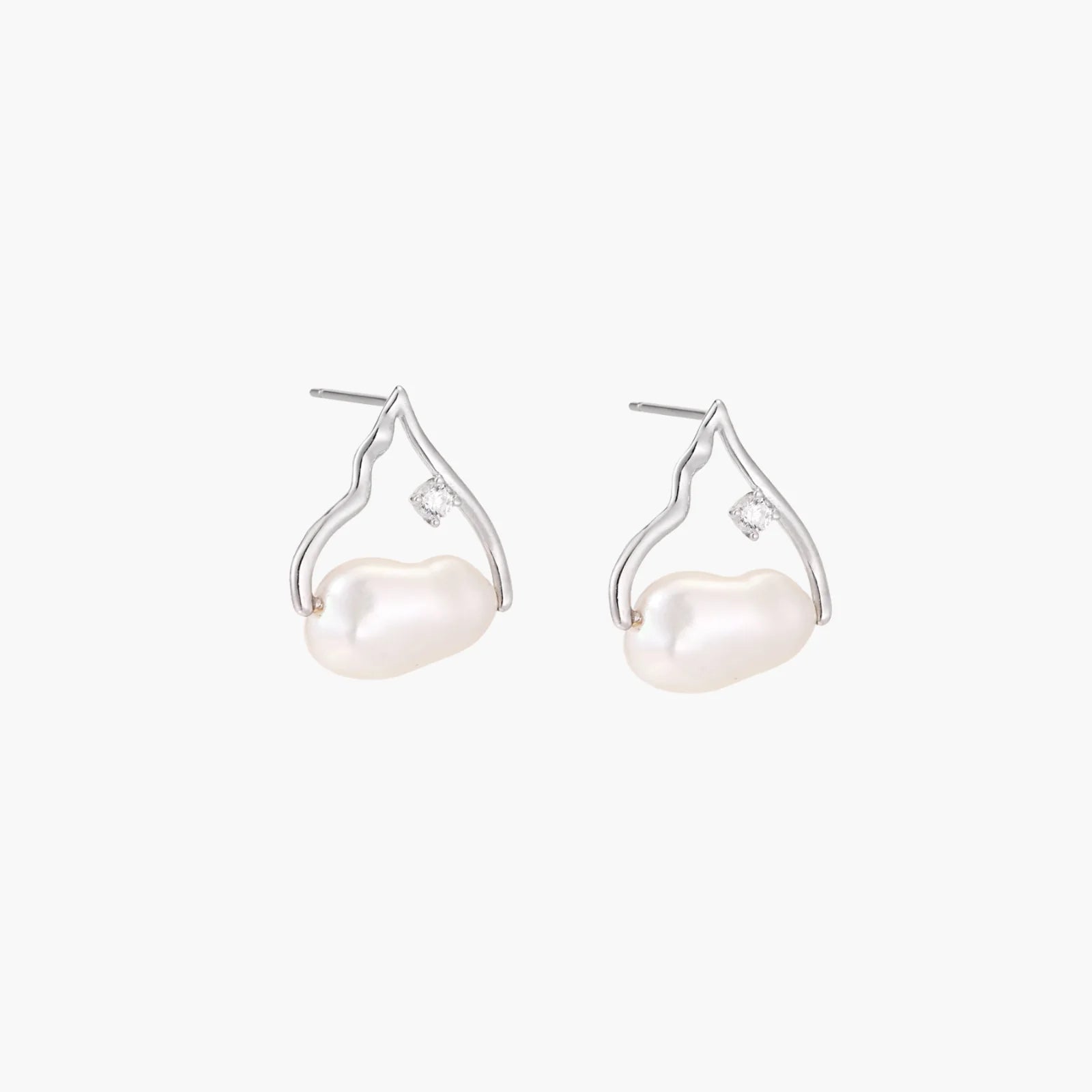 Silver mountain outline studs with baroque pearl and diamond accent on white background