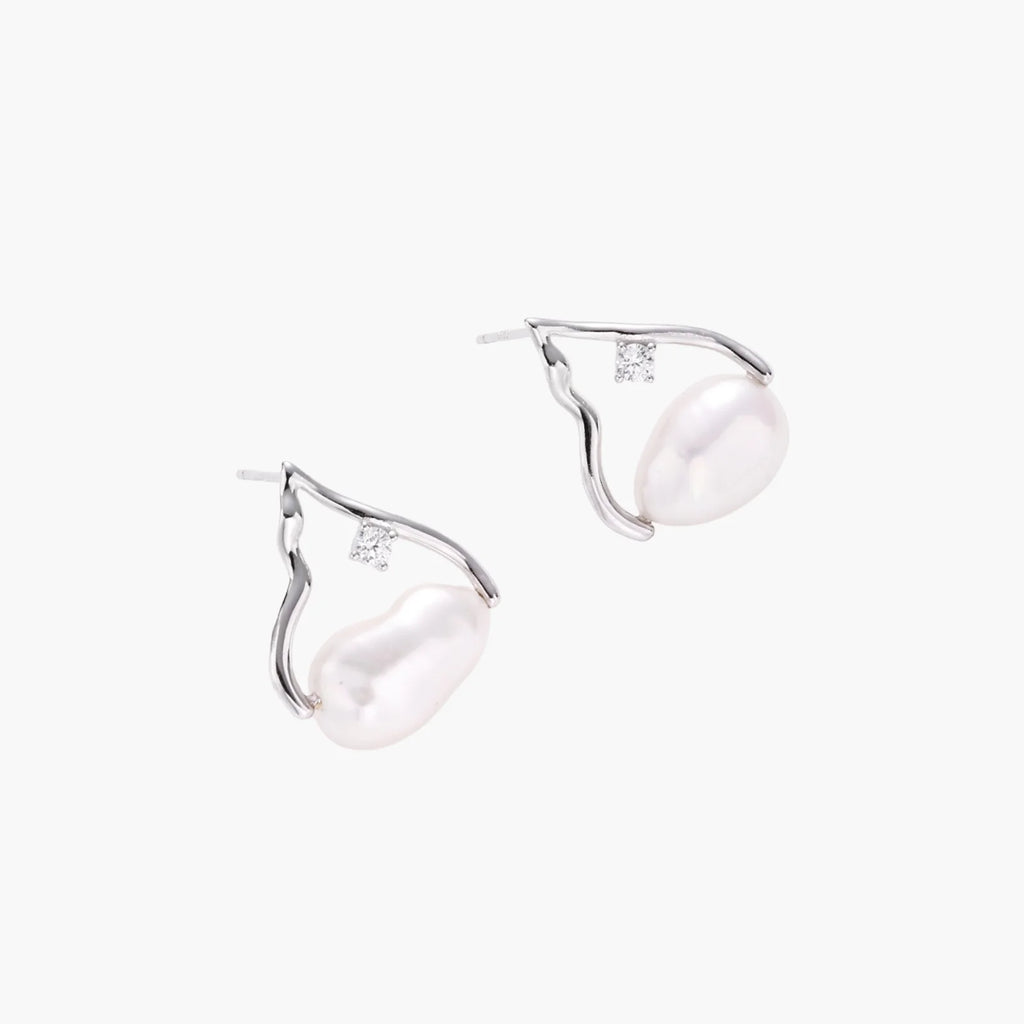 Silver mountain outline studs with baroque pearl and diamond accent on white background