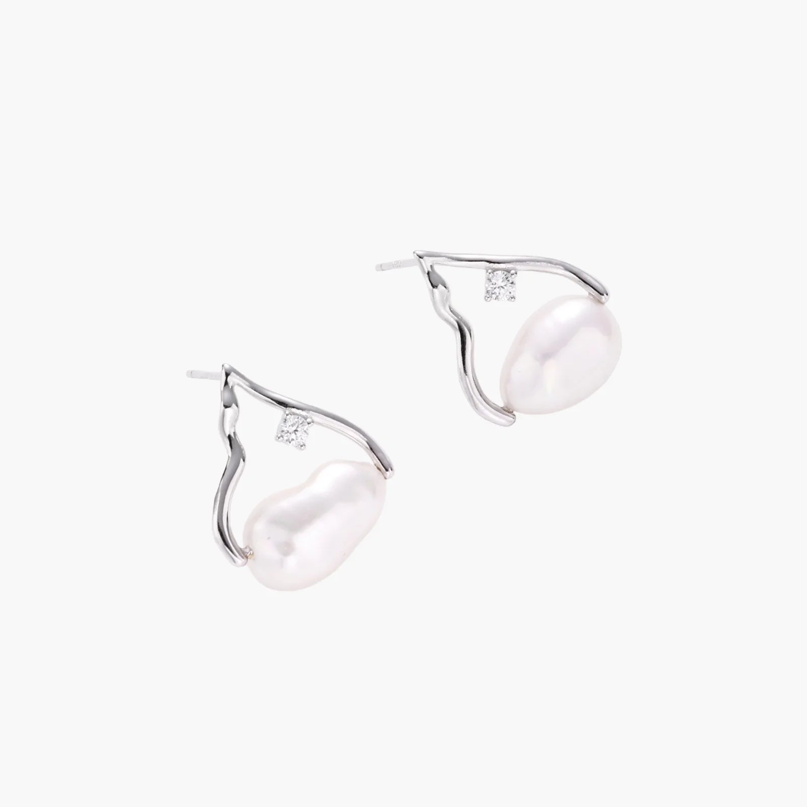 Silver mountain outline studs with baroque pearl and diamond accent on white background