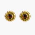 Round hammered gold studs with brown tiger's eye center surrounded by olive green liuli stones on white background.