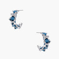 White gold plated hoop earrings with woven blue denim fabric through organic branch-like metal framework