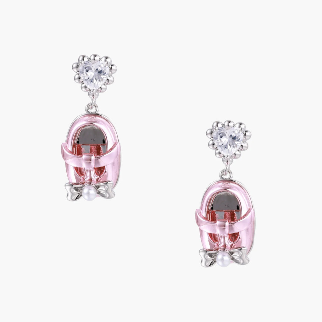 Drop earrings featuring miniature translucent handbag charms with heart crystal studs, silver bow accents, and pearls