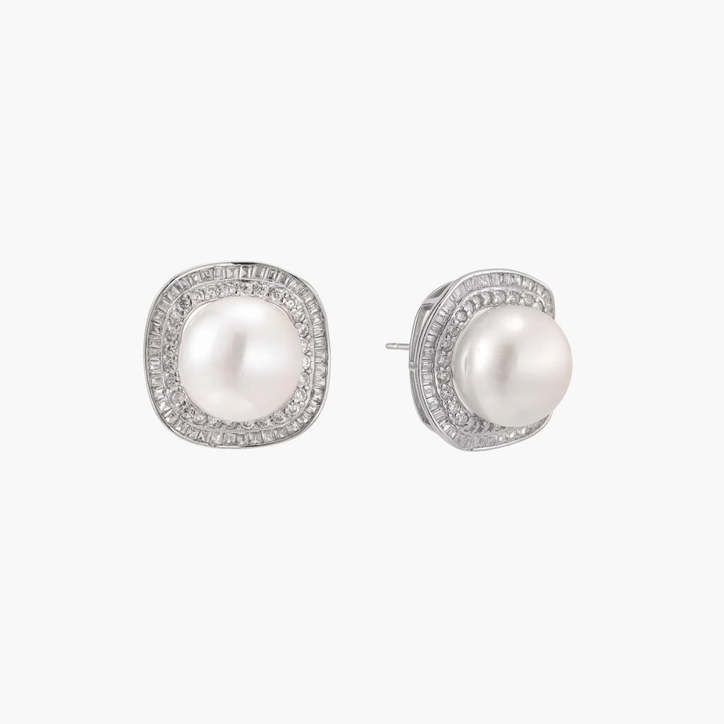 Cushion-shaped sterling silver stud earrings with freshwater pearls surrounded by geometric diamond halos