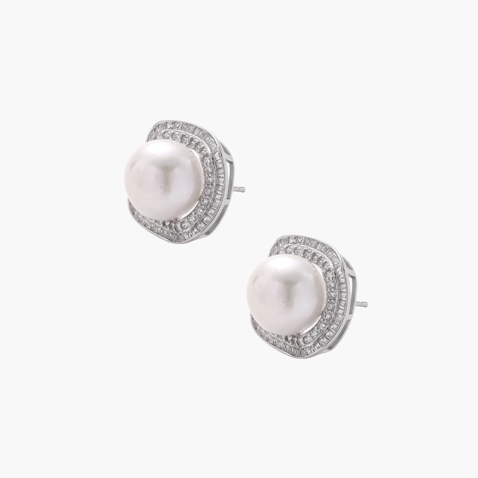 Cushion-shaped sterling silver stud earrings with freshwater pearls surrounded by geometric diamond halos