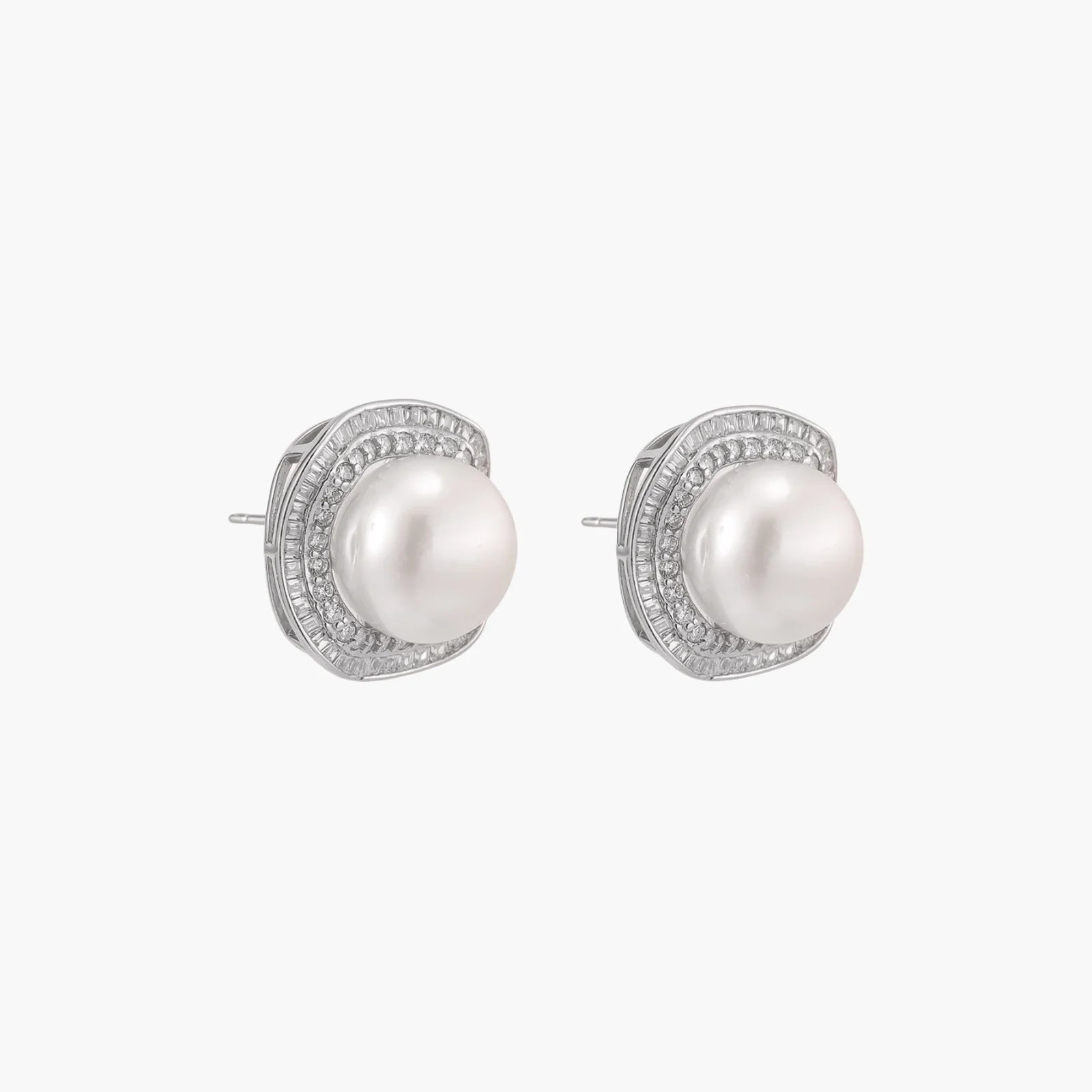 Cushion-shaped sterling silver stud earrings with freshwater pearls surrounded by geometric diamond halos